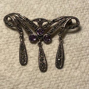 Sterling silver brooch with amethysts